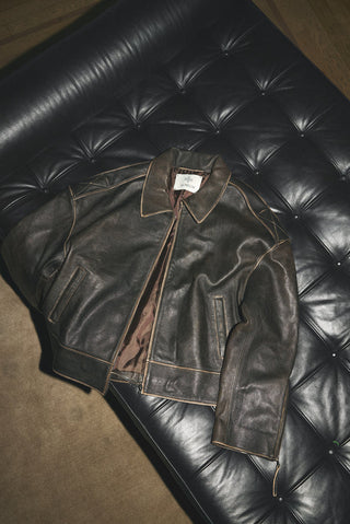 Leather jacket laying in chair