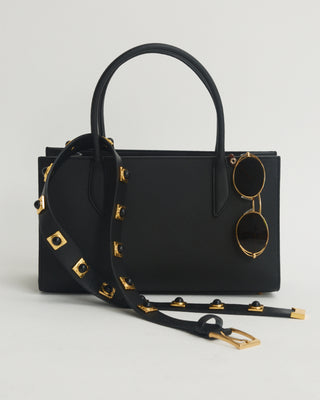 Black handbag with gold accents